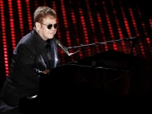 Elton John performs during the first night of Sanremo Italian Song's Festival at Ariston theater in Sanremo on February 9, 2016.